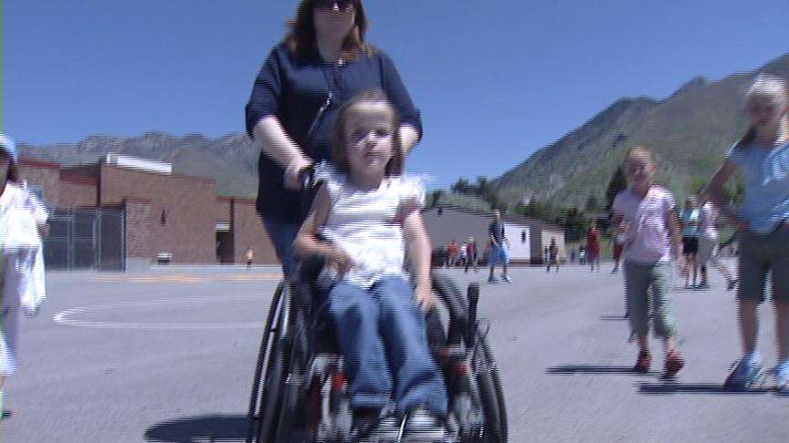 Special Swing Makes Recess Fun for Young Girl
