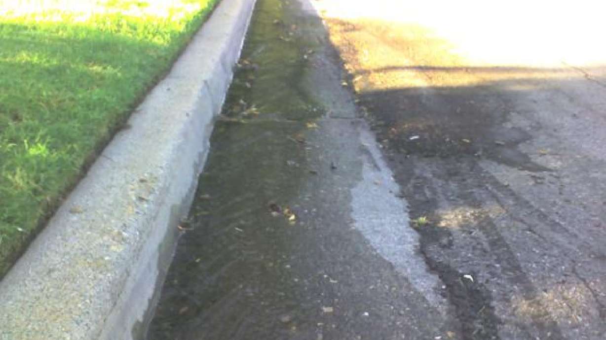 Mysterious liquid in gutter prompts road closure