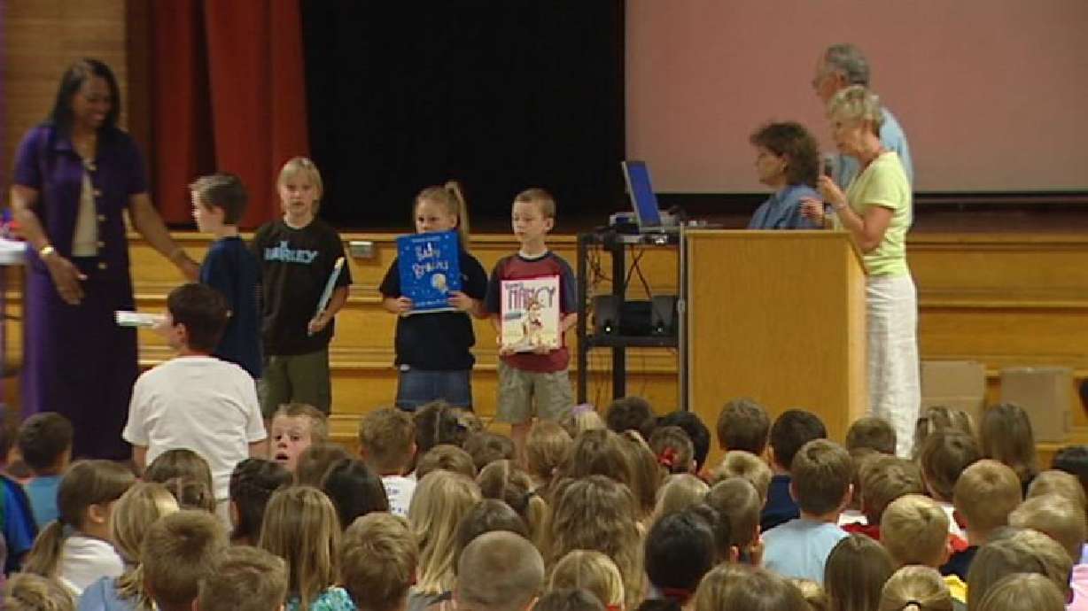 Parents Give Students Books in Daughter's Memory
