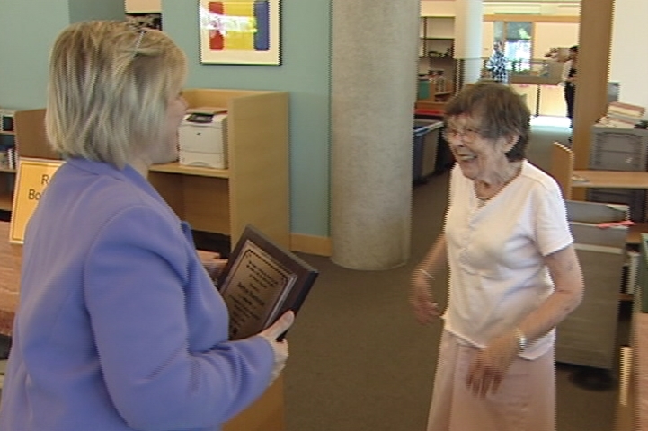 Bettye Stanhope said she was too busy volunteering at the library to attend the award ceremony, so Salt Lake County's Ann Hunter brought it to her.
