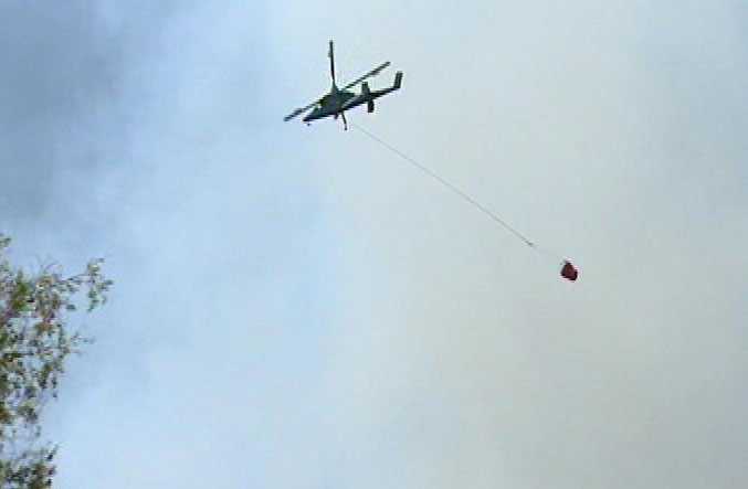 Fire crews fight the Mill Flat fire from the air
