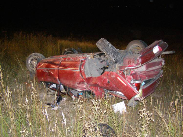 Woman dies in rollover accident
