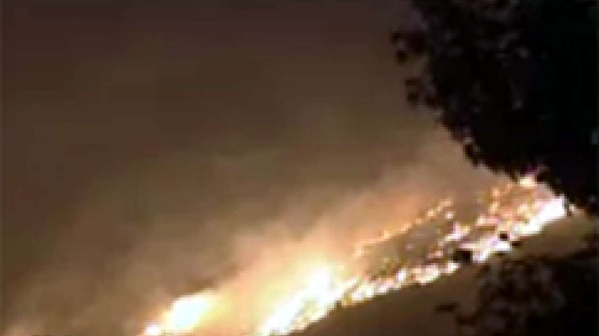 Grass Fire Threatens Homes Near U