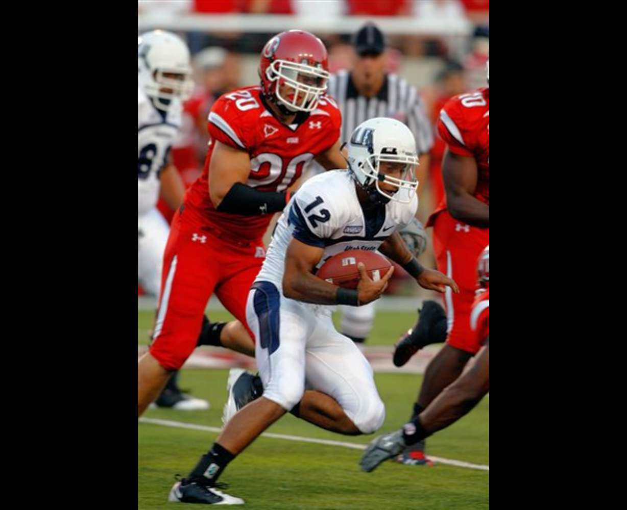 USU QB Diondre Borel runs from the Utah defense in the Aggies' 35-17 loss to the Utes.