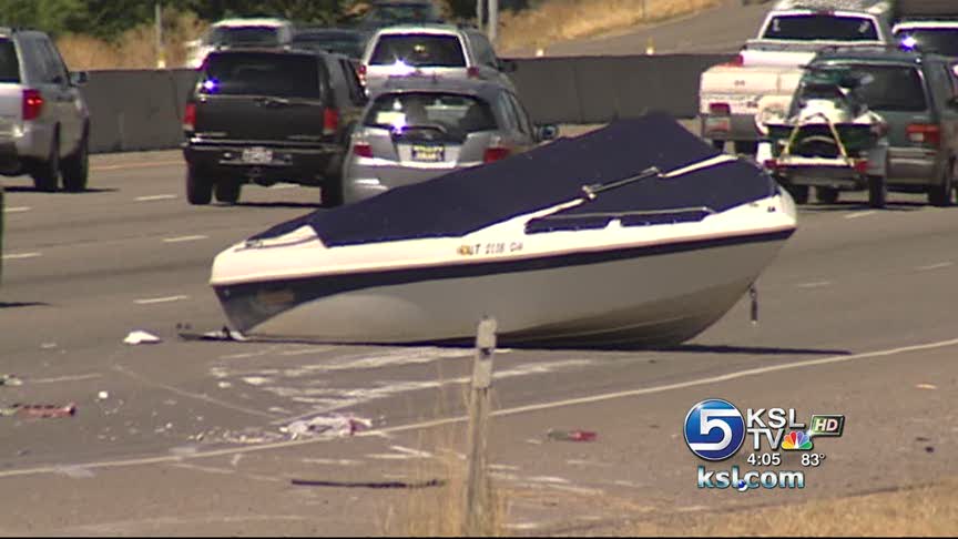 Boat falls off trailer on I-15