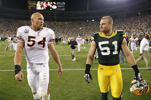 Green Bay Packers LB Brady Poppinga (51) walks off the field with Chicago Bears LB Brian Urlacher after their game Sunday, Sept. 13 in Green Bay, Wis.(AP Photo/Jim Prisching)