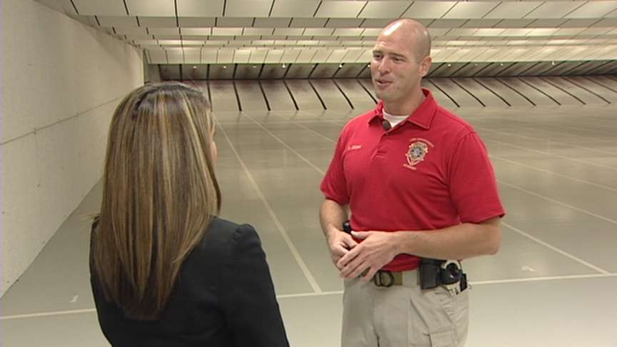 Training officer Sgt. Brad Zeeman talks to KSL's Nicole Gonzales