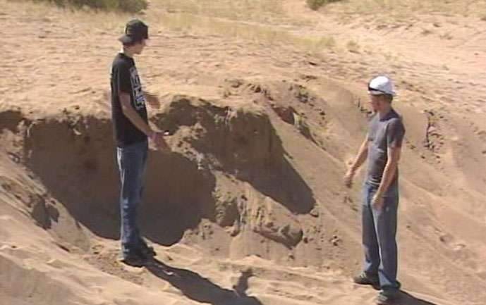 Keifer and Derrek point out the location where they found the bones