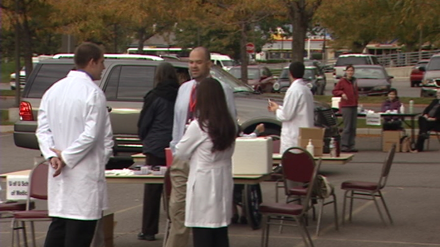 Seniors given flu shots at drive-thru clinic