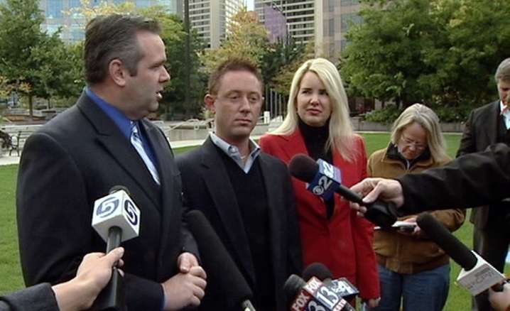 David James Bell (middle) joins his defense attorneys to address the media Monday, Oct. 5.