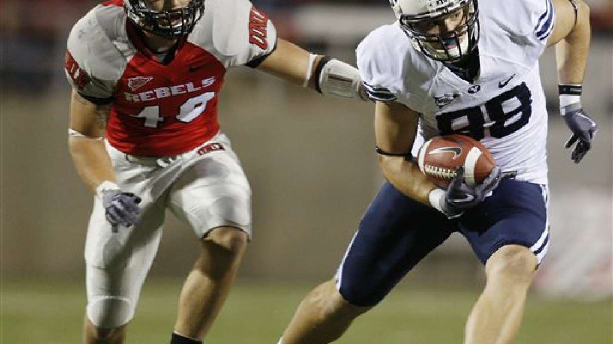 Unga runs for 3 TDs, BYU beats UNLV 59-21