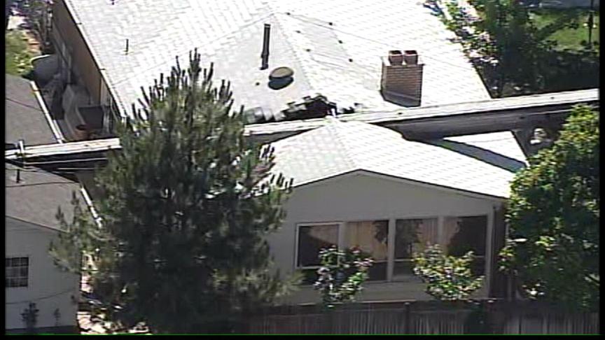 Construction Crane Topples Onto House