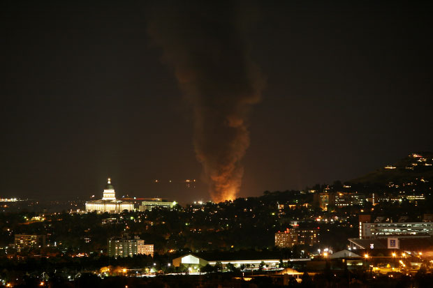 Firefighters from several agencies worked quickly to douse the flames of a fire that erupted at the Tesoro Oil Refinery in Salt Lake City on Oct. 21.