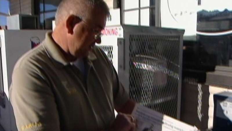 Stockton Police Chief Hinez Kopp looking at today's election results in a local paper.