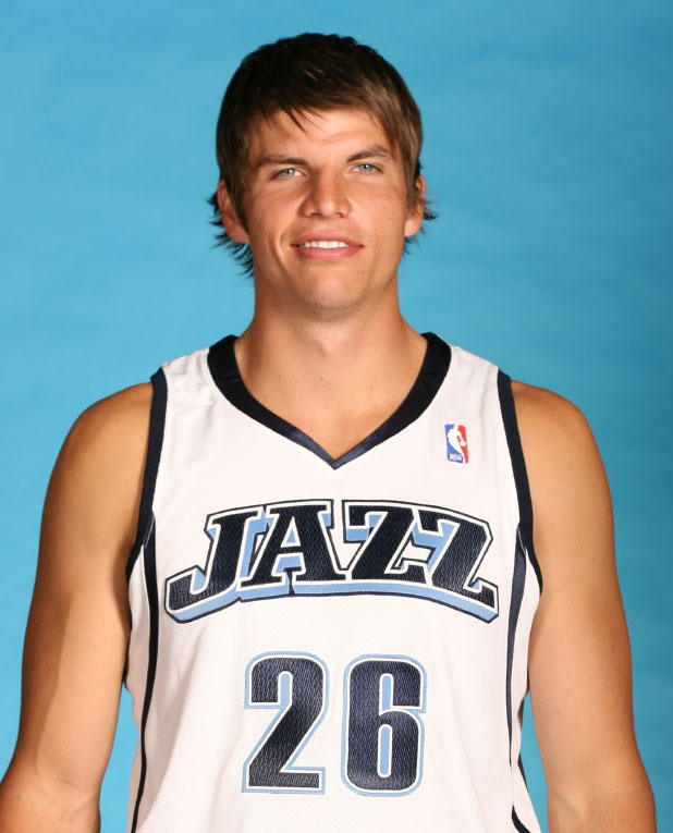 Jazz forward Kyle Korver putting on coat drive