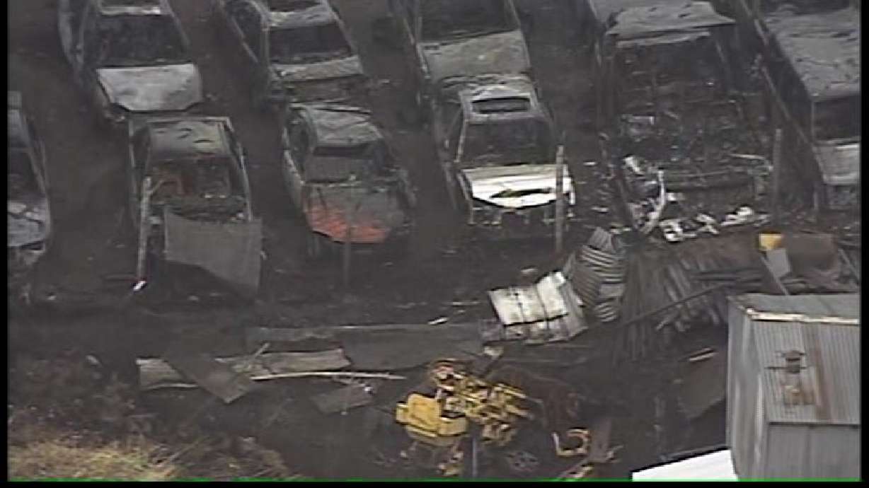 Debris Fire Spreads to Field, Cars