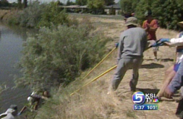 Volunteers Pull Canoes, Shopping Carts from River