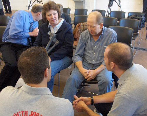 Tom and Debra Anderson meet with the paramedics who saved Tom's life last month