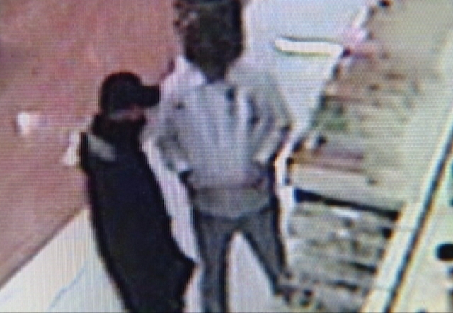 Surveillance video captures the interaction between Leon Priet and Christopher Clough during the "robbery"