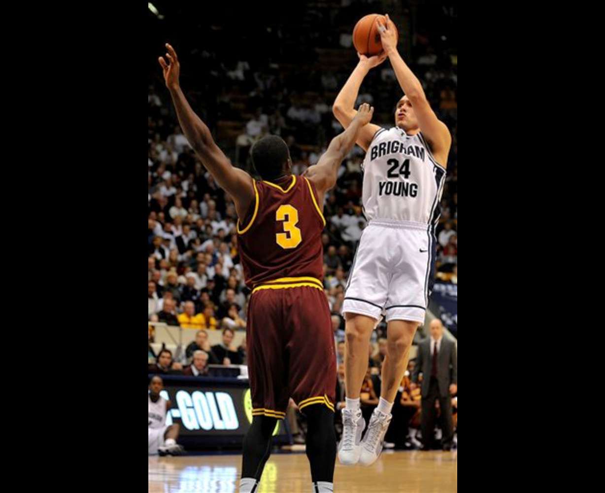 BYU guard Jonathan Tavernari shoots a three-point shot against Arizona State in the second half. (AP Photo/Patrick Smith)