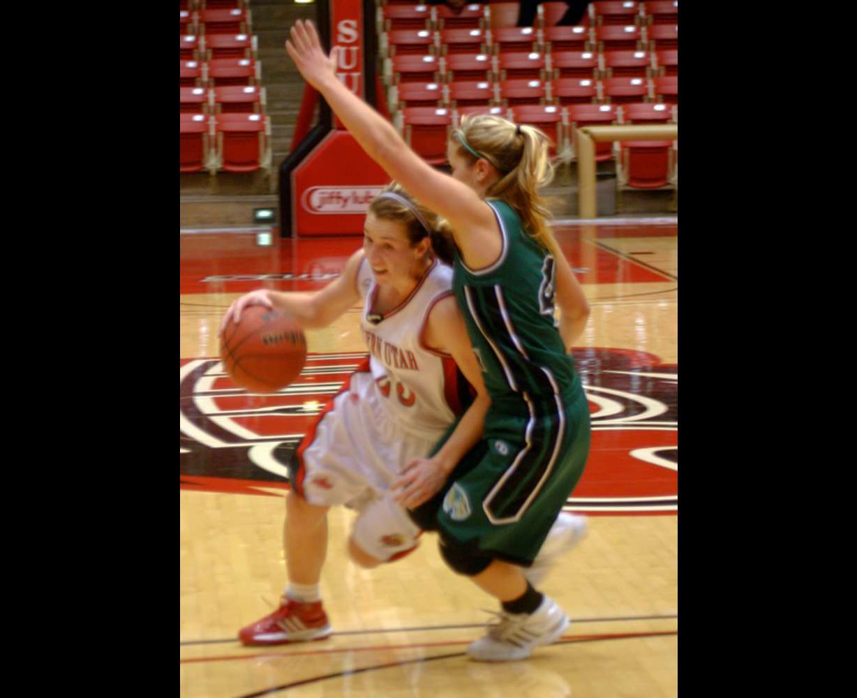 SUU's Cassie Burgess drives into the lane against a UVU defender