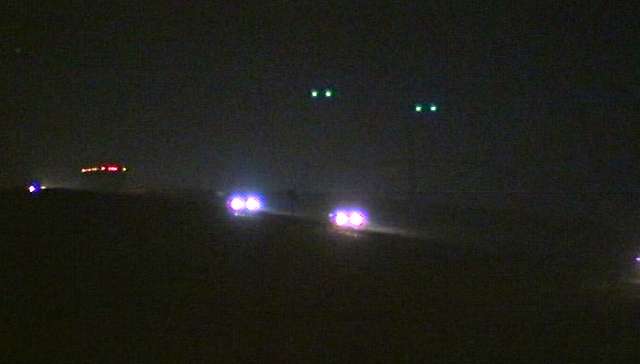 The body was found burning in a field near I-15