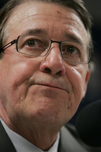 Dennis Haslam, president of the Utah Jazz, reacts as he announces his departure from the NBA basketball team during a news conference Wednesday, July 18, 2007, in Salt Lake City. (AP Photo/Douglas C. Pizac)