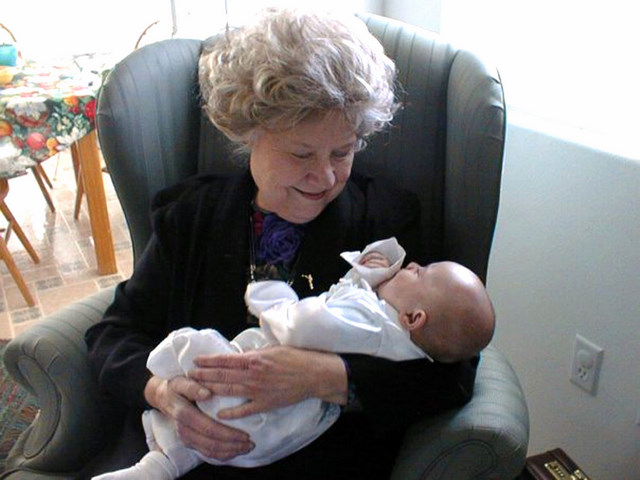 Anne Smart-Pearce, holds a grandchild in a family photo. Pearce, 86, was found badly beaten Friday, Jan. 2. Unified Police Department is looking for Arthel Martin.