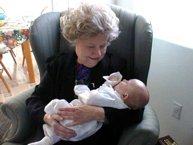 Anne Smart-Pearce, holds a grandchild in a family photo. Pearce, 86, was found badly beaten Friday, Jan. 2. Unified Police Department is looking for Arthel Martin.