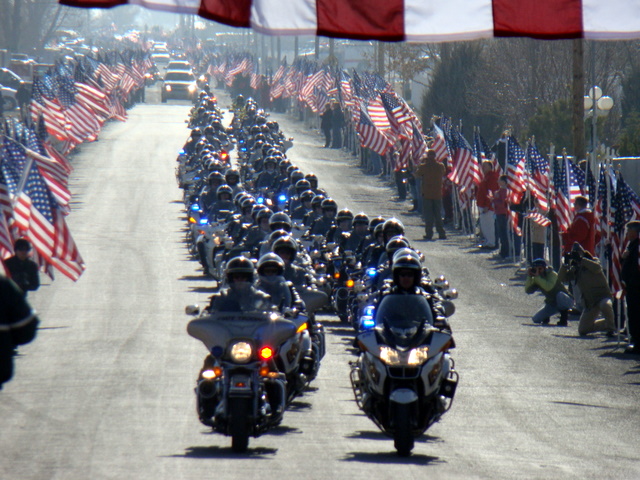 Following the service, motorcycle officers led the funeral procession to the Delta cemetery.