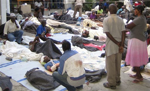 This photo provided by Medecins Sans Frontieres shows wounded people gathered at the office of Medecins Sans Frontieres in Port-au-Prince, Haiti Wednesday Jan. 13, 2010. (AP Photo/Medecins Sans Frontieres, Stefano Zannini)