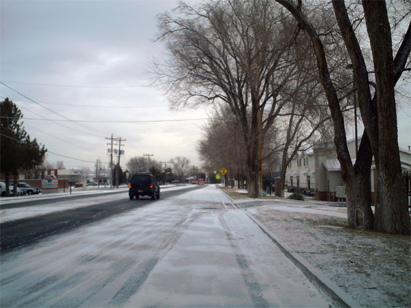 The girls walking down the street near the busy intersection of 7800 South and the Old Bingham Highway.