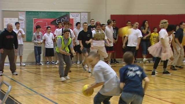 Students at Eisenhower Junior High School challenged their teachers to a game of dodgeball to raise money for their school resource officer, Doug Barney, who has cancer.