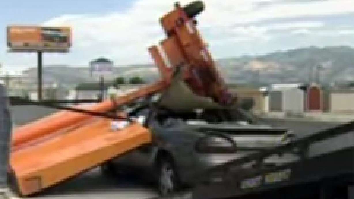 Car Collides With Message Board