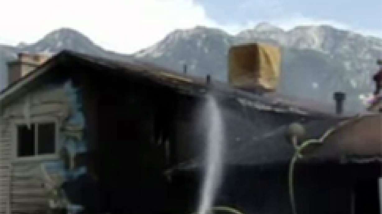 Neighbors Try to Douse House Fire