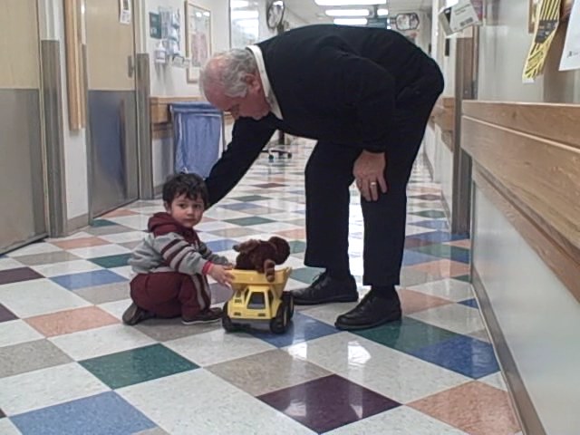 Ken Macey delivers a moose to a young patient at Primary Children's Medical Center