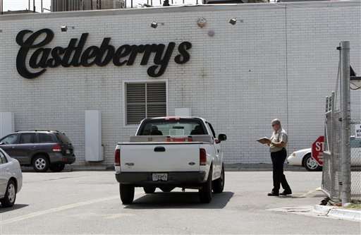 A pickup truck is checked by security at the entrance to the Castleberry's Food plant in Augusta, Ga., Tuesday, July 24, 2007. The plant has temporarily shut down after it was linked to botulism in canned chili. (AP Photo/Gene Blythe)