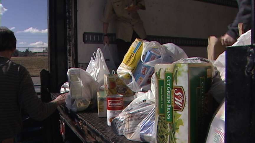 Scouts load up the food they collected during the "Scouting for Food" drive Saturday.