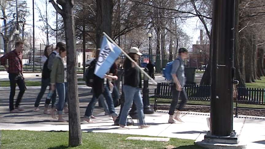 A group of barefoot believers gathered at Pioneer Park Thursday and walked to JMR to promote their cause.