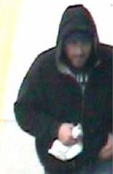 The suspect as seen in surveillance footage. Click to enlarge.