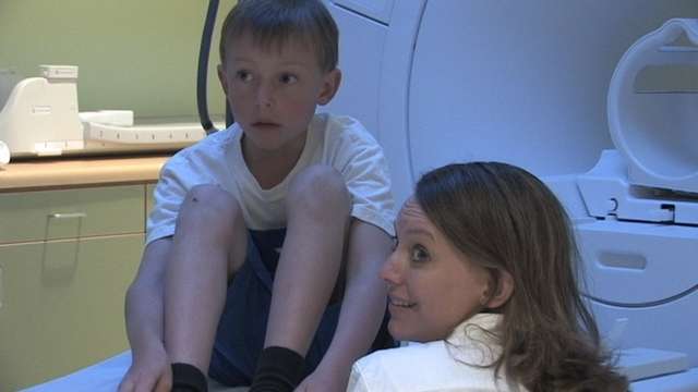 8-year-old Andrew Felsted and his mom, Missy, getting ready for Andrew's MRI scan.