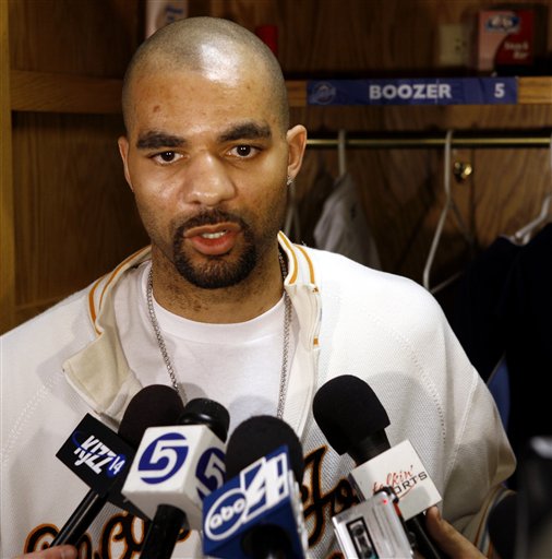 Utah Jazz center Carlos Boozer talks to reporters before cleaning out his locker Thursday, April 20, 2006, in Salt Lake City. The Jazz finished with a record of .500, not enough to make post-season playoffs. (AP Photo/Steve C. Wilson)