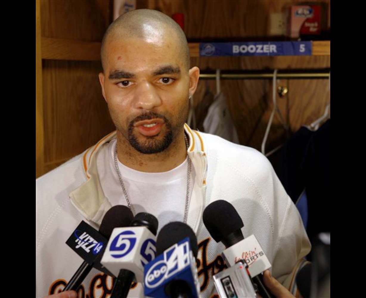 Utah Jazz center Carlos Boozer talks to reporters before cleaning out his locker Thursday, April 20, 2006, in Salt Lake City. The Jazz finished with a record of .500, not enough to make post-season playoffs. (AP Photo/Steve C. Wilson)