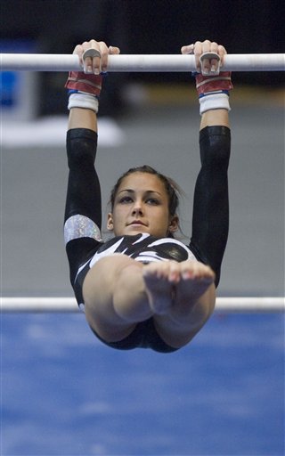 Utah's Kristina Baskett leads the Utes on the uneven parallel bars at the NCAA Gymnastics National Championships in Corvallis, Ore., Friday April 21, 2006. Utah finished second in the championships. (AP Photo/Ryan Gardner)