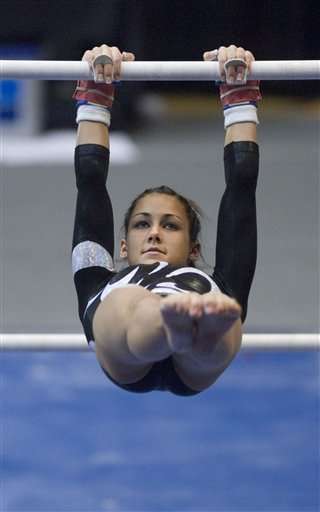 Utah's Kristina Baskett leads the Utes on the uneven parallel bars at the NCAA Gymnastics National Championships in Corvallis, Ore., Friday April 21, 2006. Utah finished second in the championships. (AP Photo/Ryan Gardner)