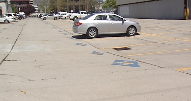 Parking lot at 256 E. 300 South where the state leases parking spaces. Many of them are empty.