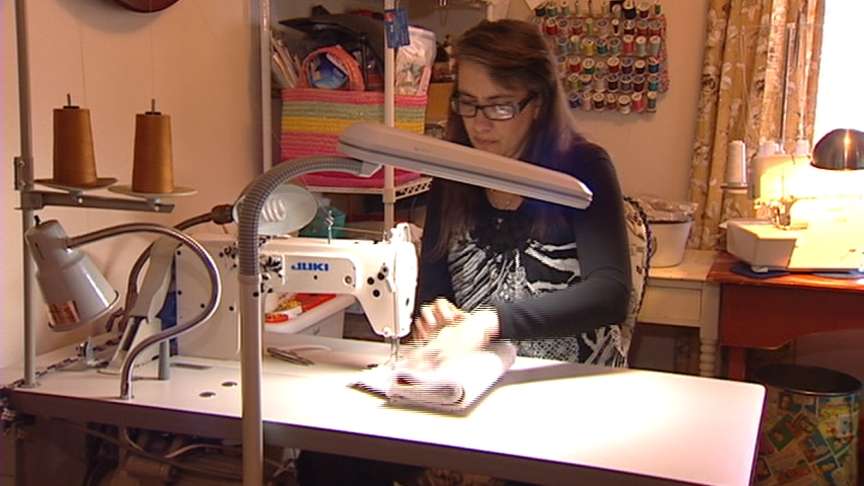 Cindy Nelson sews the Colcasac in her Herriman apartment.