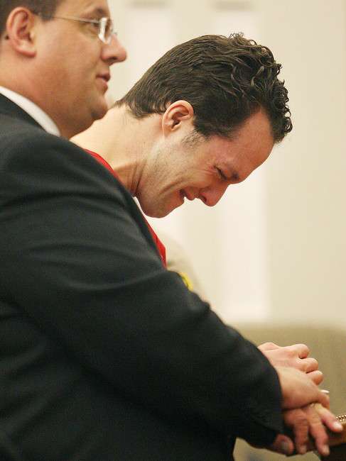 Nathanael Sloop cries, standing next to his public defense attorney Todd Utzinger, as he makes his first appearance at the Second District Court in Farmington, Utah, on May 14, 2010.(Djamila Grossman /STANDARD-EXAMINER)