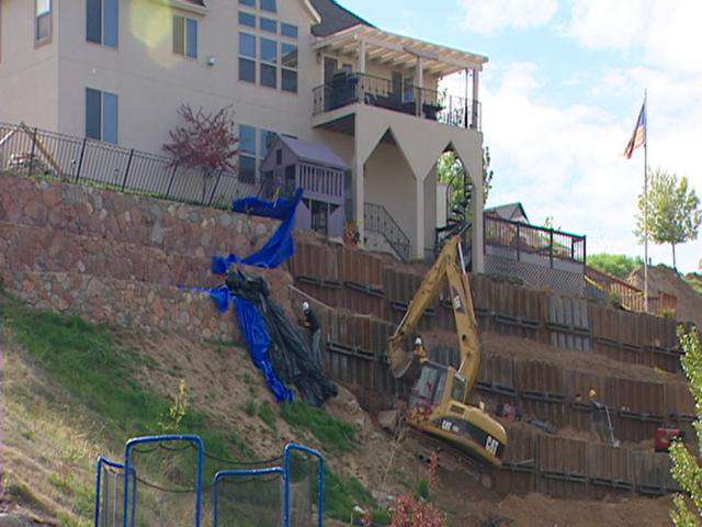 Man wants compensation for collapsed retaining wall