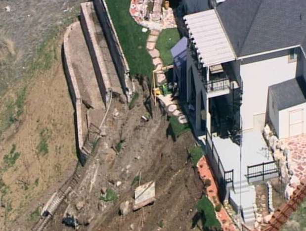 Man wants compensation for collapsed retaining wall